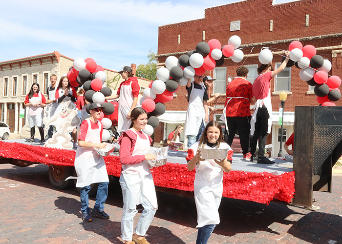 Sophomore students ride their float during parade.  Photo by Linda Drake