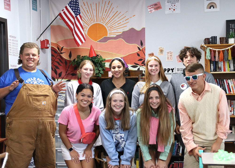 Seniors pose in English instructor Bernice Albers' room for Country Vs. Country Club day. Photo by Grace O'Brien