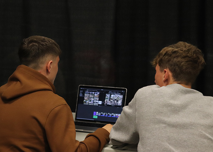 Senior Dominic Cauthers and junior Tag Groh work on editing video for their competition. Photo by Daysha Schickel.