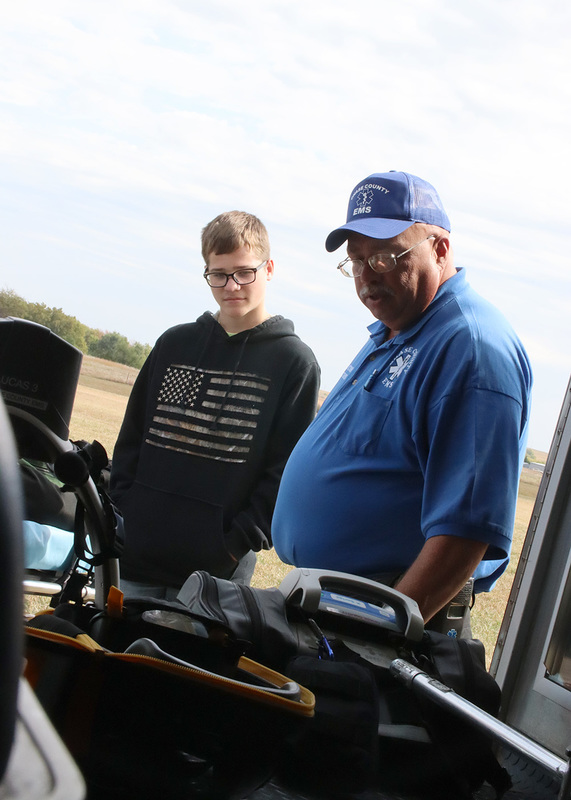 Sophomore Tyler McCorgary is shown the interior of an ambulance by EMS director Scott Harris. Photo by Linda Drake