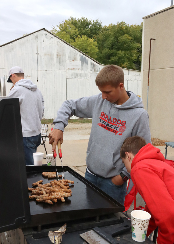 Sophomores Luke Budke and Carson Schroer make sausage for the pancake feed. Photo by Linda Drake