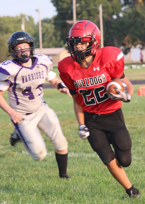 Number 22 Maddox Beyer runs the ball. Photo by Kinslea Glanville