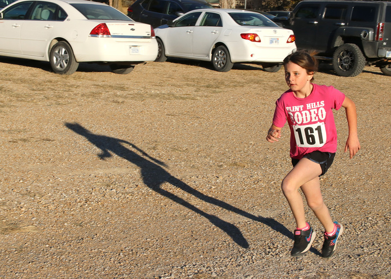 Third grader Hannah Griffin running in the pumpkin run. Photo by Linda Drake