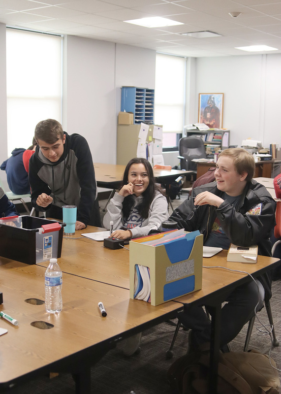 Seniors Ashlee Williams, Paden Jahnke, and Taylor Palenske practice for the next scholar's bowl meet. Photo by Leah Francis