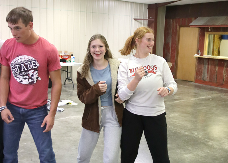 Seniors Abby Jones, Alexis DeLong and Junior Brock Griffin play "People to People" at TASMAD. Photo by Linda Drake