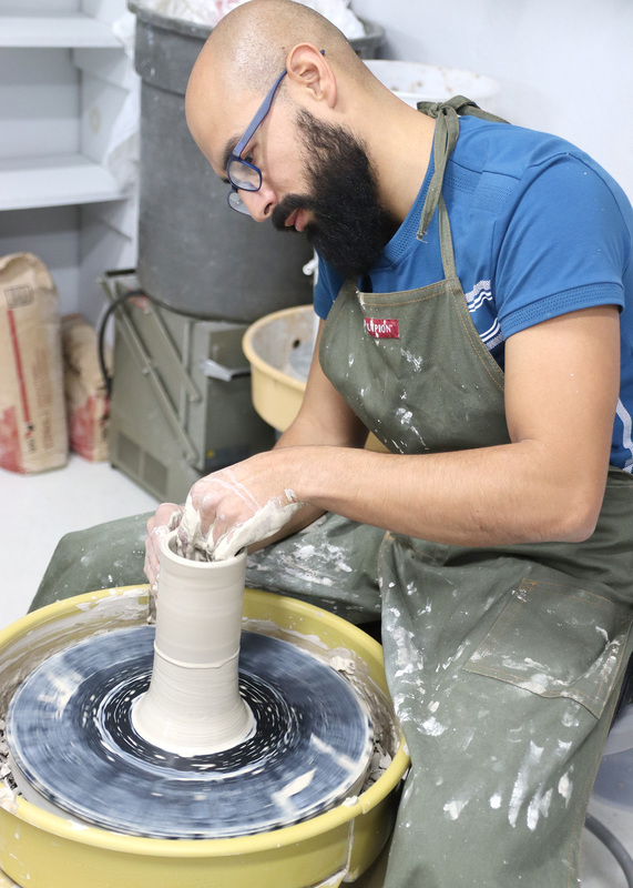 Art instructor Hugo Escobar creates his own project, which allows students to learn from his methods. Photo by Abby Jones
