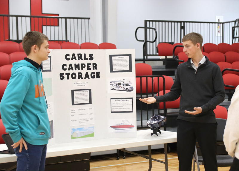Junior Josiah McKee and sophomore Carson Schroer present their business idea for the YEC. Photo by Grace O'Brien