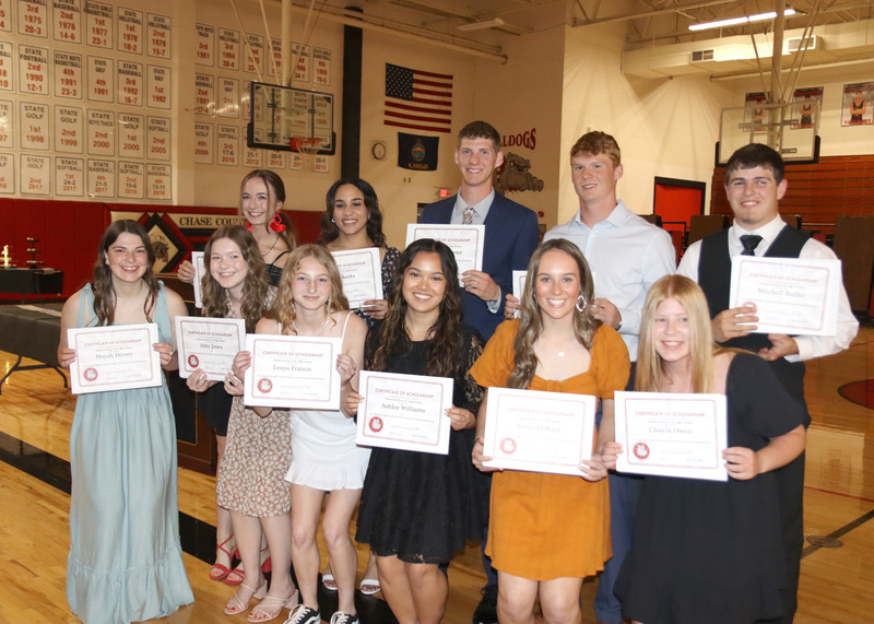 Seniors hold their scholarships after Honor's Banquet. Photos by Linda Drake